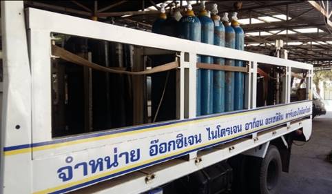 A truck with blue cylinders on it

Description automatically generated